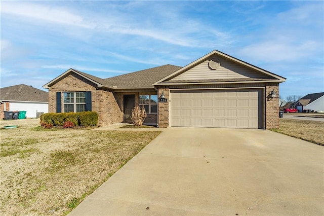 single story home with a garage, concrete driveway, and brick siding