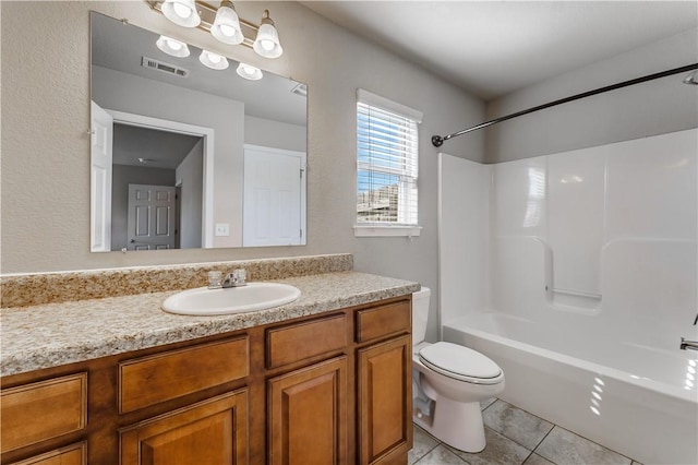 full bathroom featuring tile patterned flooring, toilet, vanity, visible vents, and  shower combination