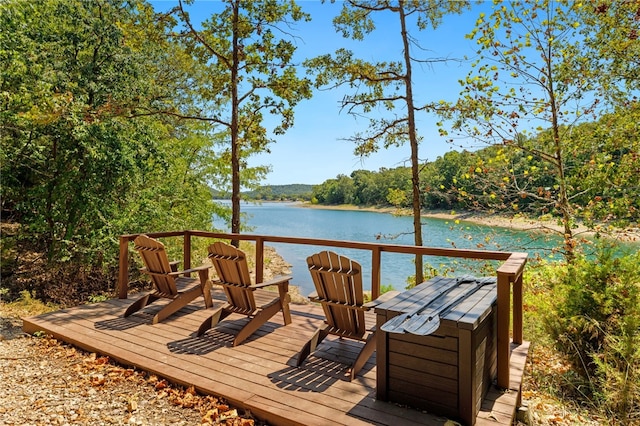 wooden deck featuring a water view