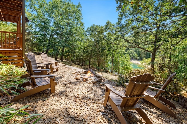 view of yard featuring an outdoor fire pit