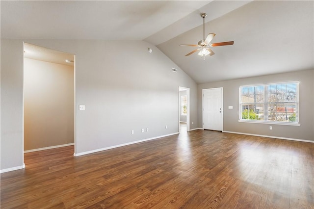 unfurnished room featuring lofted ceiling, a ceiling fan, a wealth of natural light, and wood finished floors