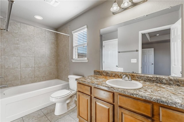 bathroom featuring shower / tub combination, vanity, toilet, and tile patterned floors