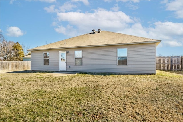 back of property featuring a fenced backyard, a patio, and a yard