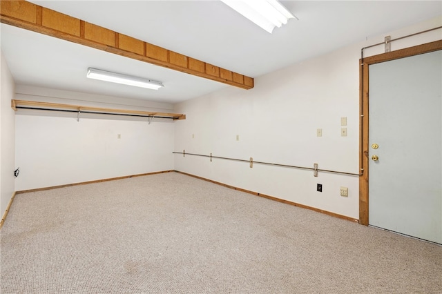 interior space with carpet floors and baseboards