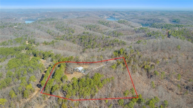 aerial view featuring a wooded view