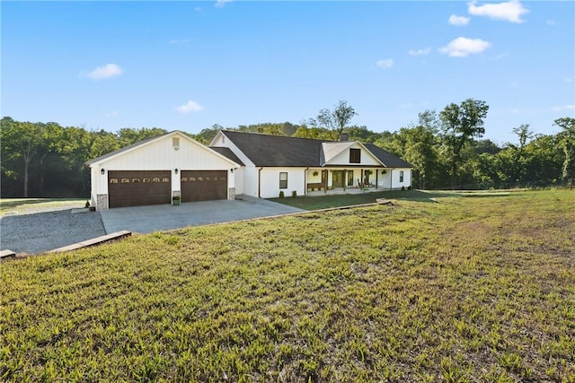 ranch-style home featuring driveway, a garage, and a front lawn