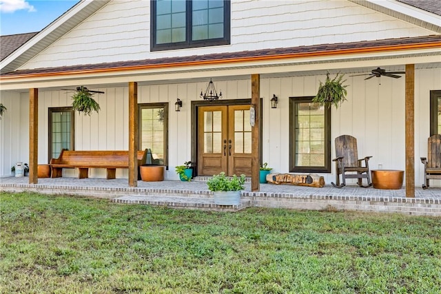 entrance to property with ceiling fan, french doors, a porch, and a shingled roof