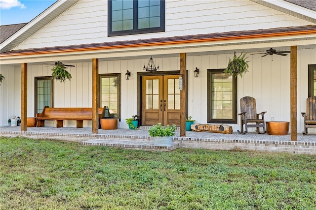 3205 Mc 4021, Everton, AR 72633 - property entrance featuring french doors, covered porch, a lawn, ceiling fan, and roof with shingles