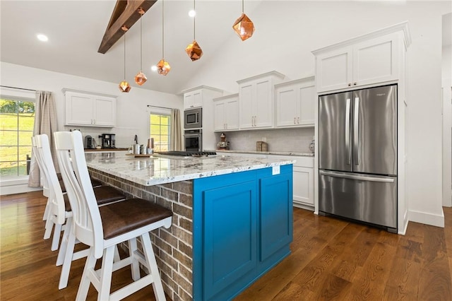 3205 Mc 4021, Everton, AR 72633 - kitchen featuring stainless steel appliances, dark wood finished floors, white cabinets, tasteful backsplash, and a breakfast bar area