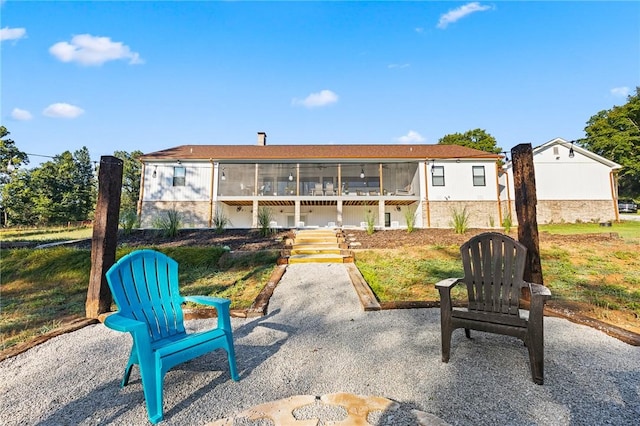 exterior space featuring a sunroom