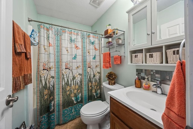 bathroom with visible vents, toilet, curtained shower, a textured ceiling, and vanity