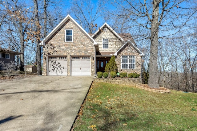 view of front of property with driveway, brick siding, and a front lawn