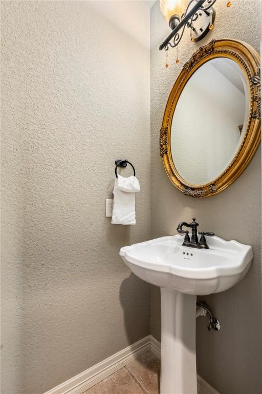 bathroom featuring tile patterned flooring and baseboards