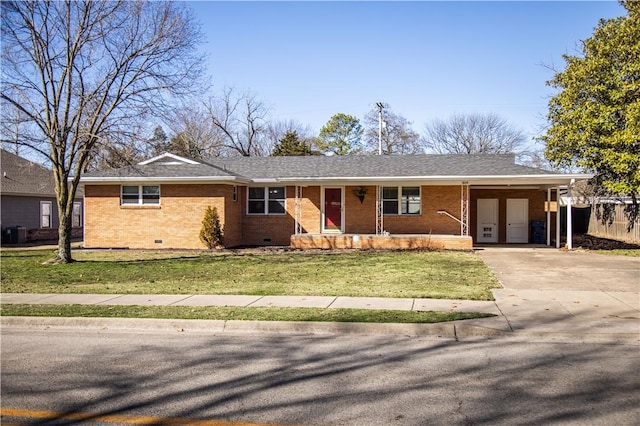 ranch-style house featuring brick siding, a shingled roof, concrete driveway, a front yard, and crawl space