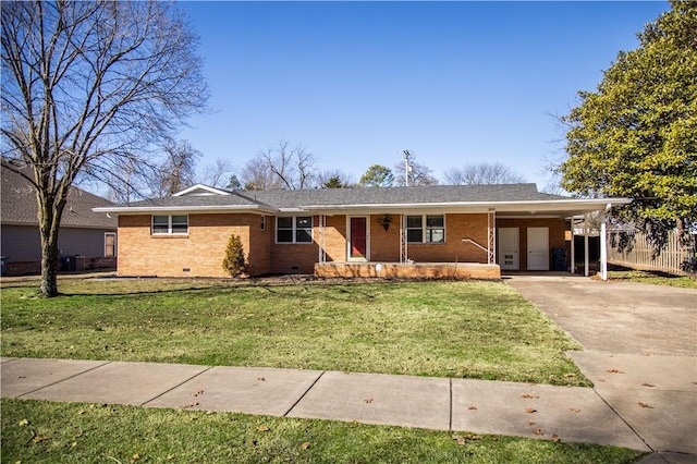 ranch-style home featuring crawl space, driveway, a front lawn, and a carport