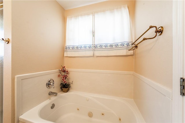 bathroom with a jetted tub