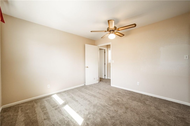 unfurnished bedroom with a ceiling fan, carpet, and baseboards