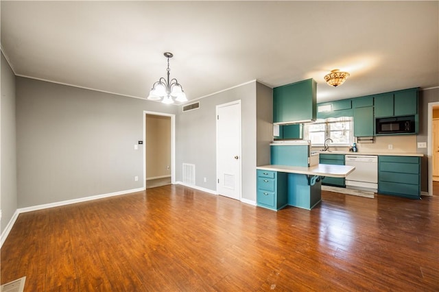 kitchen featuring visible vents, black microwave, green cabinets, and dishwasher