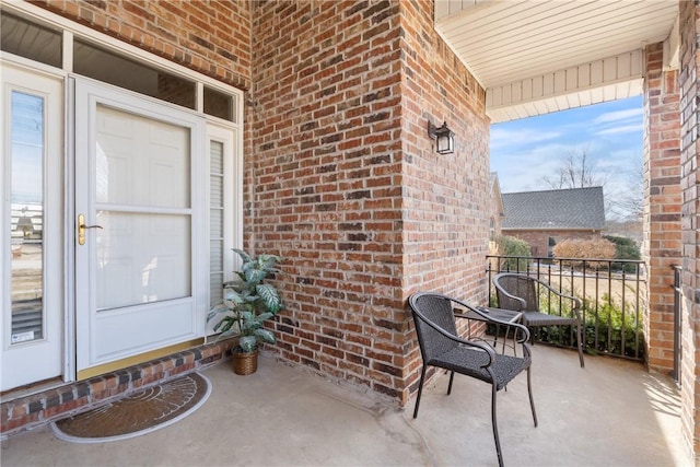 entrance to property with brick siding