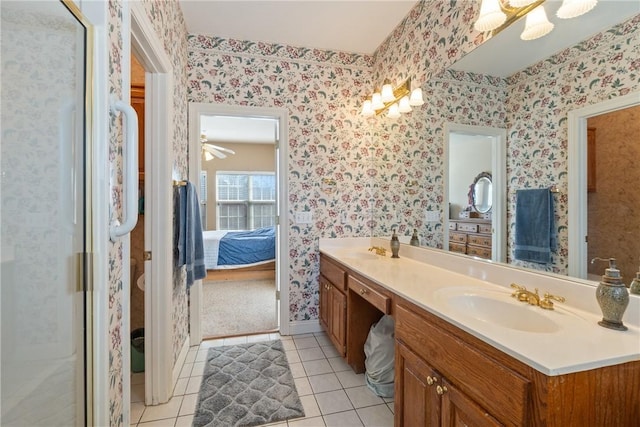 ensuite bathroom with wallpapered walls, ensuite bath, and a sink