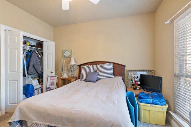 bedroom featuring a closet, a ceiling fan, and carpet flooring