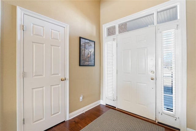 entrance foyer featuring dark wood-type flooring and baseboards