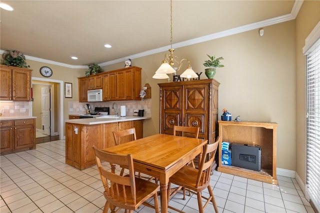 dining area featuring light tile patterned floors, a fireplace, and crown molding