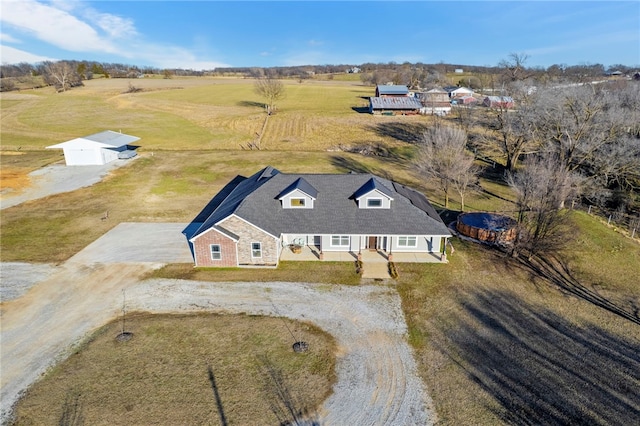 birds eye view of property featuring a rural view