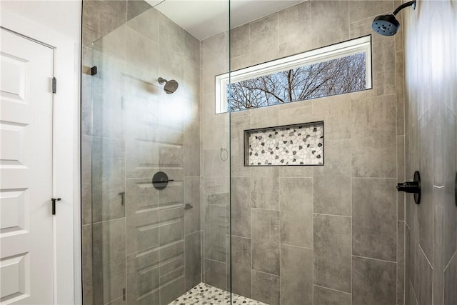 full bath featuring a tile shower