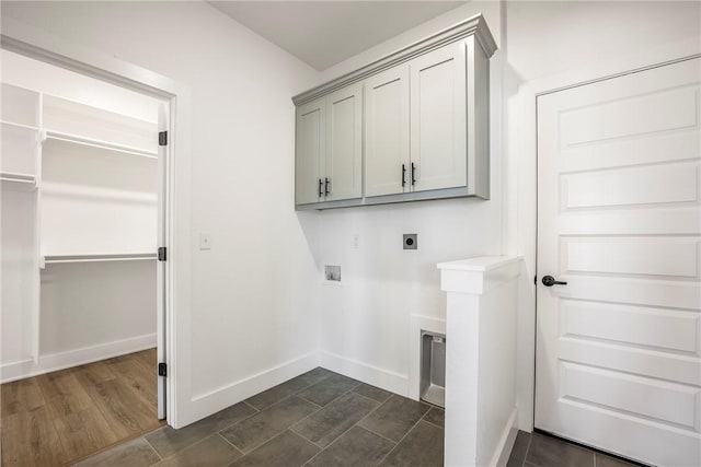 laundry room featuring baseboards, washer hookup, cabinet space, and hookup for an electric dryer