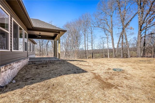 view of yard with a ceiling fan