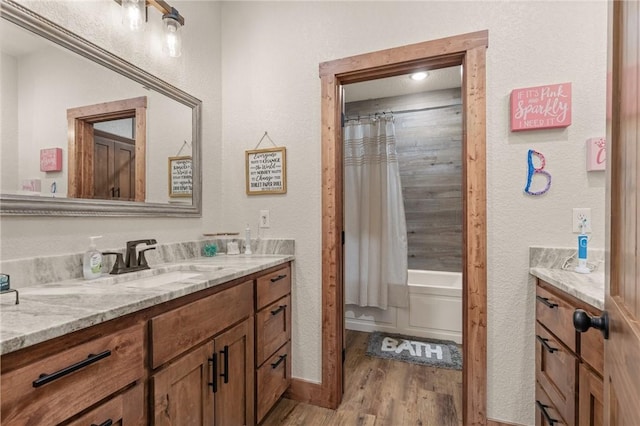 full bath featuring shower / bath combination with curtain, wood finished floors, and vanity