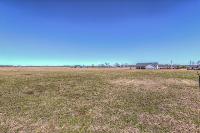 view of yard with a rural view