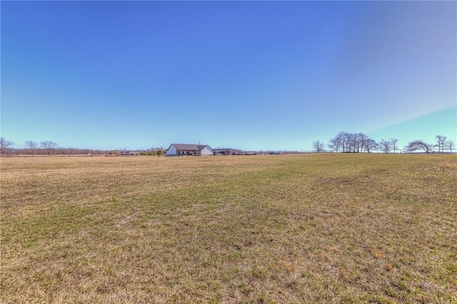 view of yard with a rural view