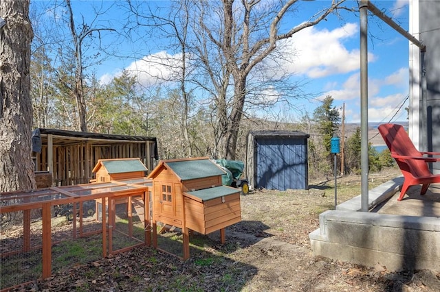 view of play area featuring an outdoor structure and exterior structure