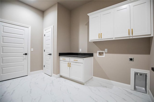 laundry area with baseboards, marble finish floor, cabinet space, and hookup for an electric dryer