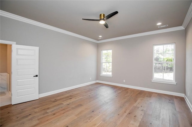 spare room featuring baseboards, visible vents, ornamental molding, wood finished floors, and recessed lighting