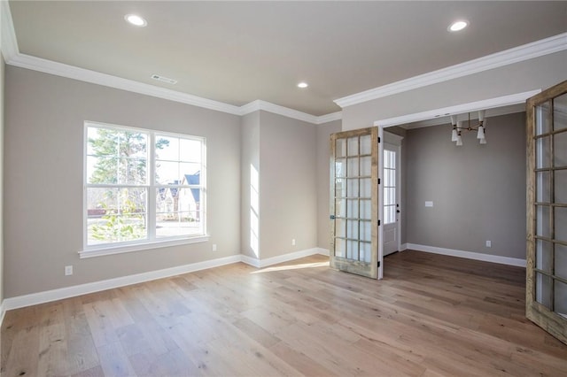 spare room with french doors, recessed lighting, light wood-style flooring, ornamental molding, and baseboards