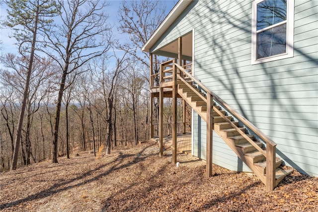 view of side of property with stairway