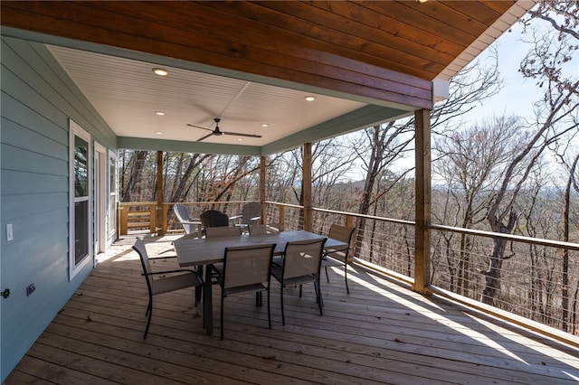 wooden deck with ceiling fan and outdoor dining space