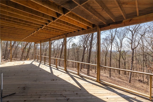 deck featuring a forest view