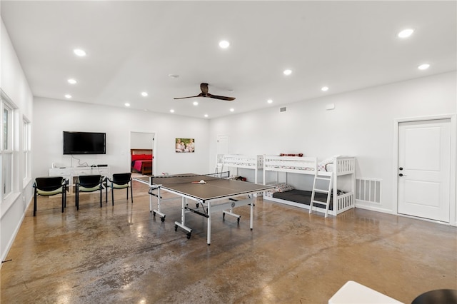 playroom featuring concrete flooring, recessed lighting, visible vents, and a ceiling fan