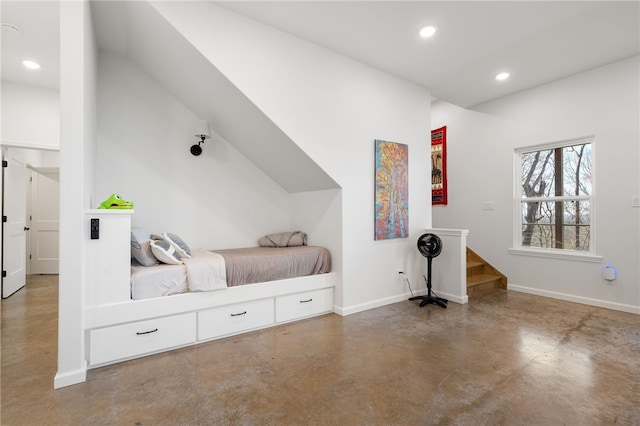 bedroom with baseboards, recessed lighting, and finished concrete floors