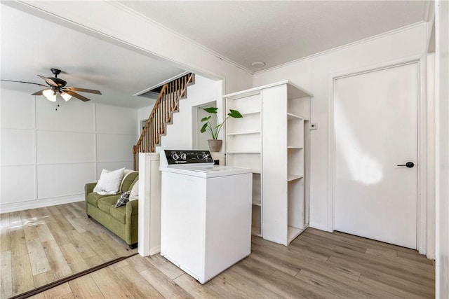 washroom with a ceiling fan, washer / clothes dryer, crown molding, and light wood-style flooring