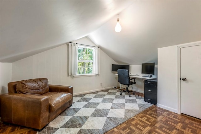 office area with vaulted ceiling and baseboards