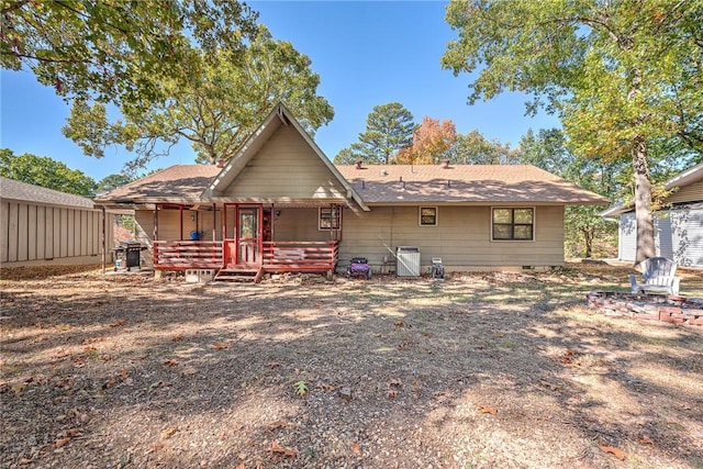 rear view of house featuring a porch and crawl space