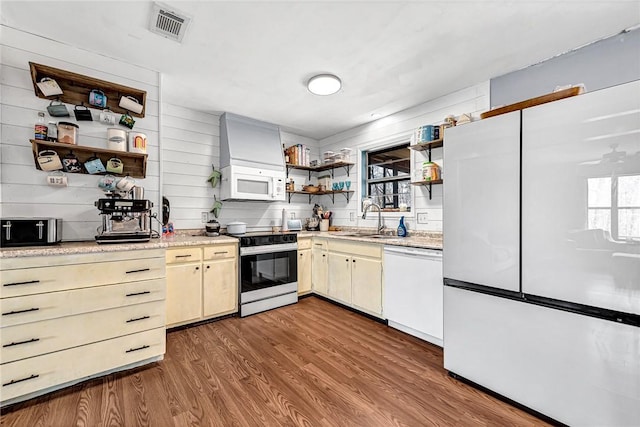 kitchen with white appliances, a sink, visible vents, open shelves, and dark wood finished floors