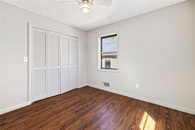 15 White St, Eureka Springs, AR 72632 - unfurnished bedroom with baseboards, a closet, visible vents, and dark wood-type flooring