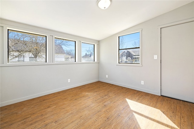 15 White St, Eureka Springs, AR 72632 - empty room with light wood-style floors, baseboards, and vaulted ceiling