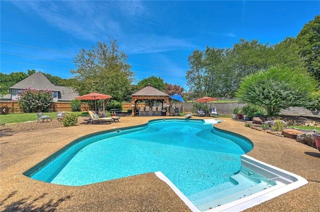 view of pool featuring a fenced in pool, a patio, a fenced backyard, a gazebo, and a diving board